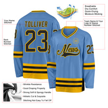 Load image into Gallery viewer, Custom Light Blue Black-Gold Hockey Jersey
